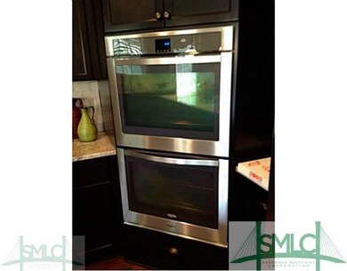 Kitchen. Gourmet kitchen includes double ovens, gr