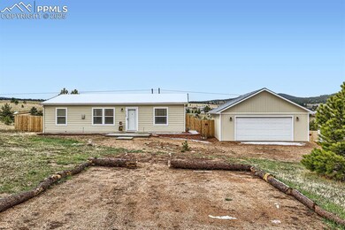 Ranch-style house with a garage and fence