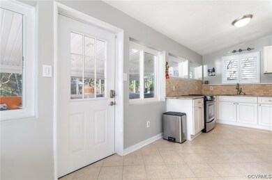 Access door from kitchen to sunroom.
