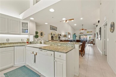 Kitchen with light tile patterned floors, a ceilin