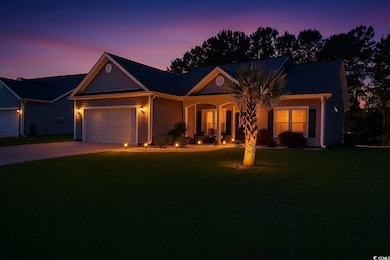 Ranch-style house featuring an attached garage, covered porch, a yard, and driveway