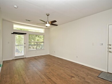 Unfurnished room with a ceiling fan, visible vent