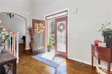 Foyer featuring visible vents, baseboards, and woo