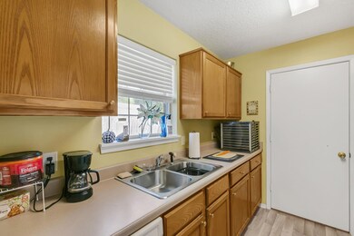 Kitchen featuring sink and light wood-type floorin