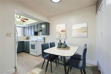 Virtually Staged. Dining room and kitchen.