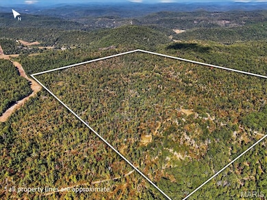View of property location with property parcel outlined and a mountain backdrop