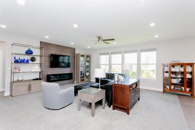 Great room with electric fireplace & custom wood s