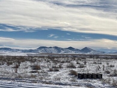 Standing on Lot looking over Windflower Road.  Box