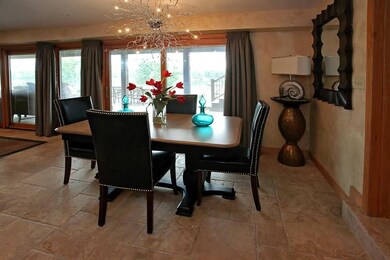 Dine with a view.  Travertine Flooring.  Pella doo