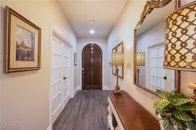 Foyer with french doors leading to den.