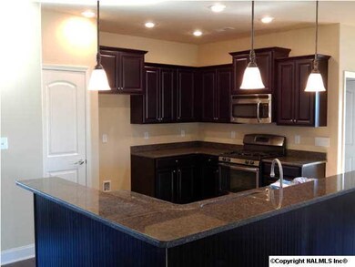 View from raised bar to Kitchen.
