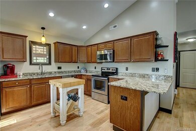 Well planned kitchen with breakfast bar.