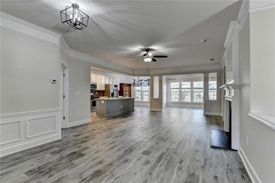 Unfurnished living room featuring light wood-style