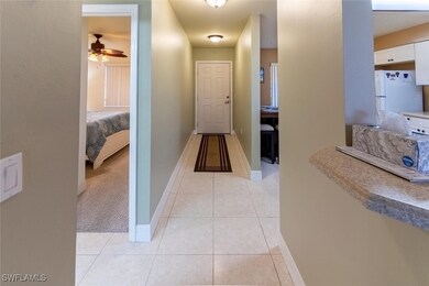 Hall with light tile patterned floors