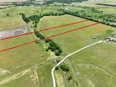 Birds eye view of property featuring a rural view