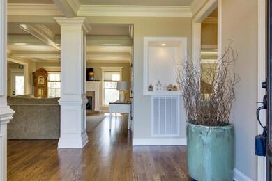 Hardwood floors throughout the main level living areas.  Framed niche in foyer. 