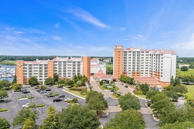 Aerial view of apartment complex and a nearby body of water