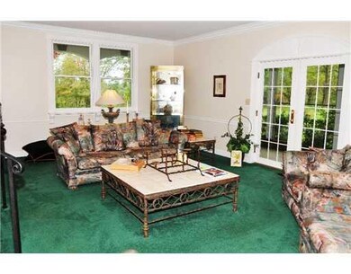 Living Room. French doors open to screened patio a
