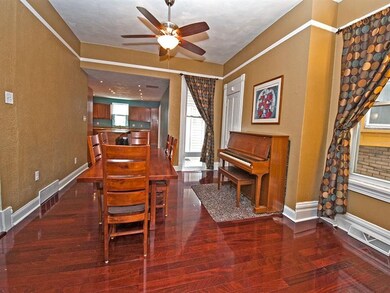 The dining room has newer hardwood floors, high ce