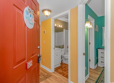 Hallway with light hardwood / wood-style floors