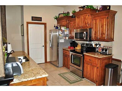 Kitchen. This unique kitchen boasts decorative arc