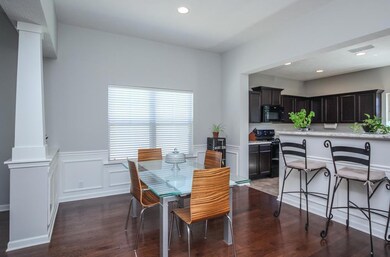 The dining room has beautiful trimwork, hardwood floors, and more!