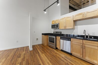Open Kitchen Area with Original Hardwood Floors