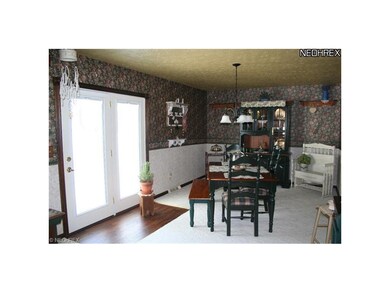 Dining room off of kitchen. French Doors have retr