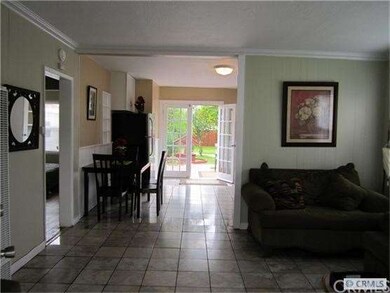 looking from living room through french doors to b