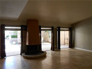 Living Room. Gas fireplace and view of the back ya