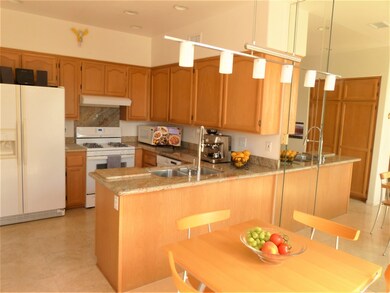 Updated kitchen has Granite Countertops and Traver