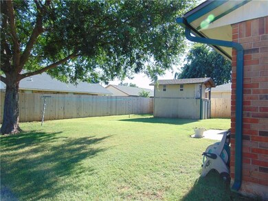 This inviting back yard with great shade and a sto