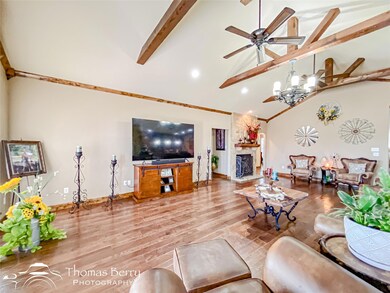 Living room featuring wood finished floors, high v