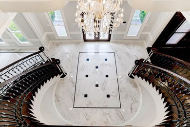 Dual staircases and carrera porcelain floors will surely make your guests stop in their tracks
