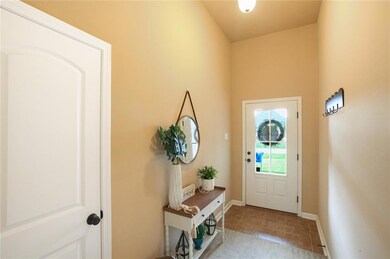 Foyer with 11 ft ceiling.