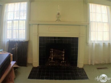Black tiled wood fireplace in living room