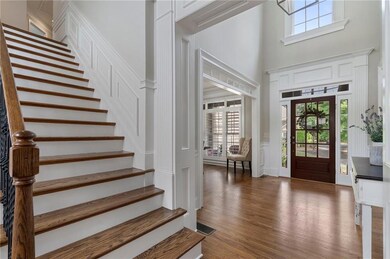Foyer featuring visible vents, wood finished floor