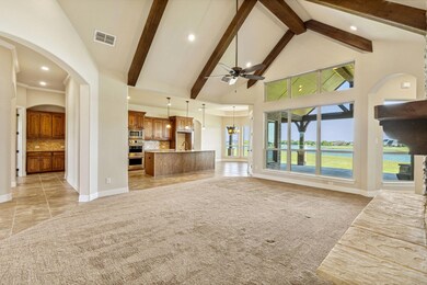 Living Room features vaulted ceilings with beams a