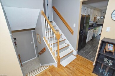 Upstairs is the living room with hardwood floors.