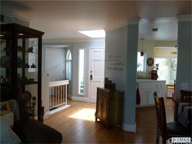 Front door with skylight at entry, directly to liv