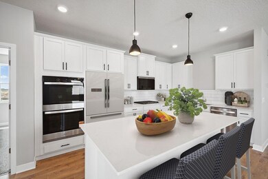 Rightsizing or downsizing doesn't mean you have to give up a great kitchen! Photo virtually staged, appliance package will vary. Photo of model home, finishes, colors, and selections will vary.
