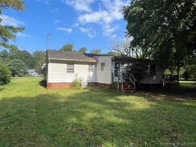 Exterior space featuring a yard