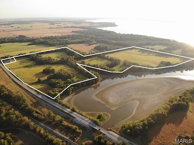 Aerial view of property's location with property boundaries highlighted and a nearby body of water