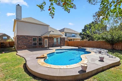 View of pool with a fenced backyard and a patio