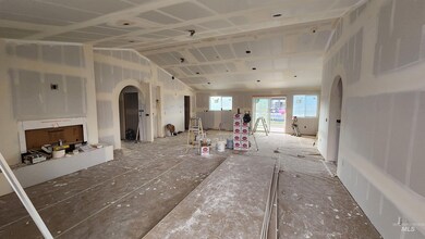 Living space with kitchen area as seen from the Living room looking towards back of home