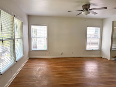 Empty room with wood finished floors, plenty of n