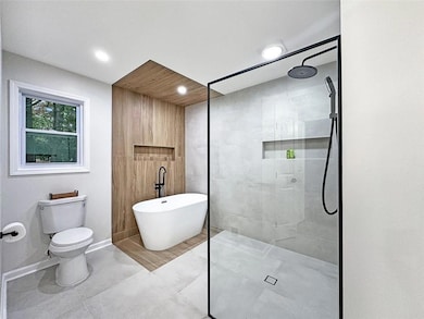 Primary Bath with Curb-less Shower & Free Standing Tub