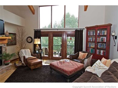 Living Room. Gas fireplace with stone hearth in a