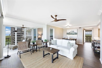 Living room with ornamental molding, ceiling fan, 
