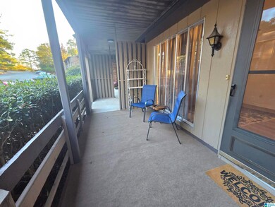 FRONT PATIO W/ NEW OUTDOOR CARPET